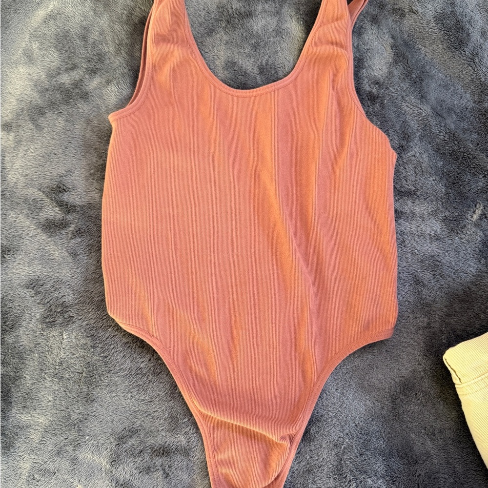 Sleek Pink Bodysuit with High-Cut Design
